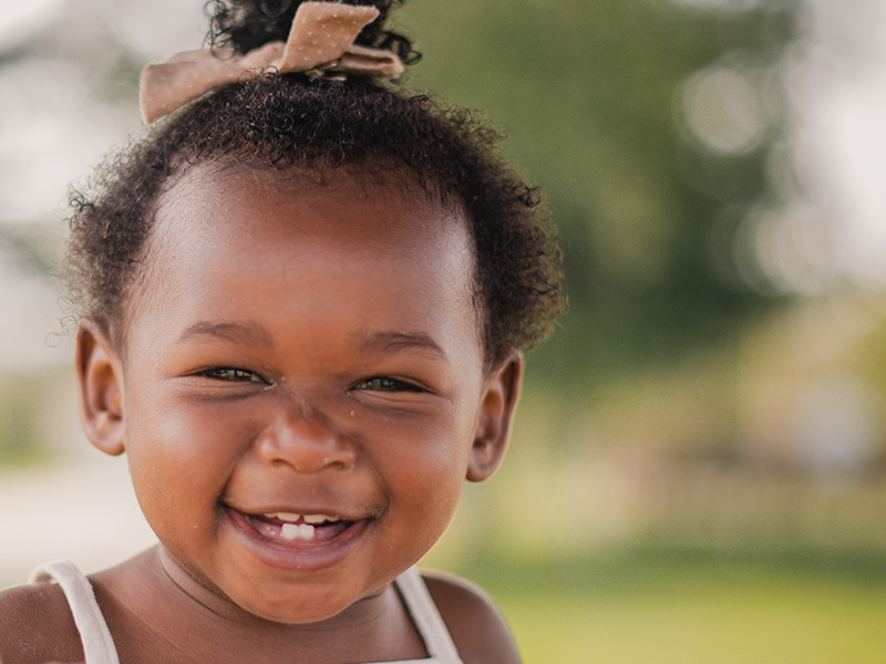 Girl with pig tails smiling