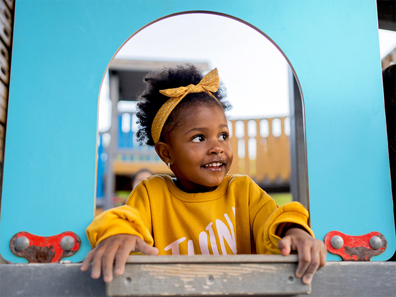 Girl with pig tails smiling